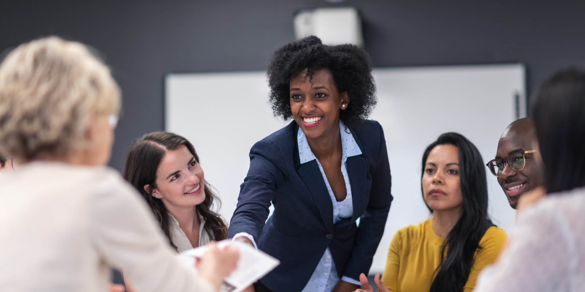 Women at a desk on a board