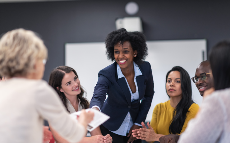 Women at a desk on a board