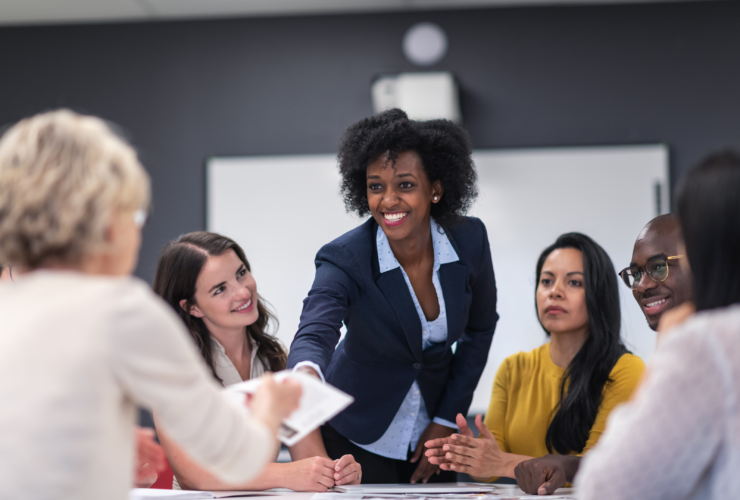 Women at a desk on a board