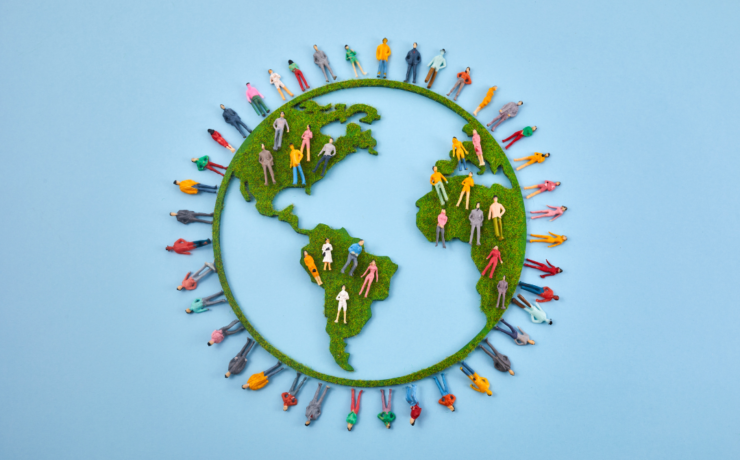 Animated picture of the Earth with diverse clay people around it and inside it.